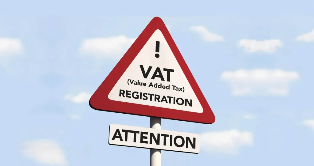 in this picture there is a sign board on which written HMRC VAT Registration .